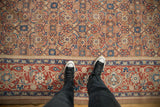 Antique Persian carpet's wide Turtle Samovar border next to the allover Herati design field.