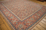 Antique Persian carpet corner displaying the camel Herati field alongside the wide Turtle Samovar border.