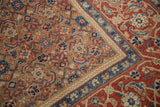Corner view of an antique Persian rug's camel Herati field and complex Turtle Samovar border.