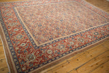 Angled view of a Northwest Persian carpet's camel Herati field and detailed red Turtle Samovar border.