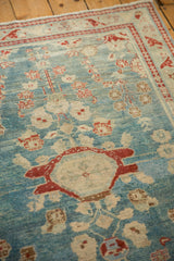 Heavily abrashed sky blue Lilihan rug with cherry red medallion and floral top views.