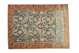 Vintage distressed Mehreban rug with a Caucasian-inspired design in dusty teal, rust, and ivory, showing prominent abrash.