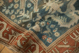 Bird motif and serpent-like border detail on a distressed hand-knotted Persian Mehreban rug.