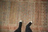 A personal view of the heavy color variation and low-pile texture on a distressed Kurdish rug.