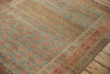 Low-pile texture and decorative color abrashes on the corner of a vintage Kurdish Hamadan rug.