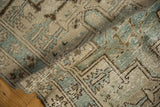 Distressed pile of the Karaja runner, showing geometric ivory and powder blue motifs.