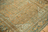 The vintage Bibikabad rug's distressed texture highlights the Turtle Samovar border motif.
