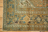 Worn pile showing the Turtle Samovar border motif in dusty blue and gold on a vintage rug.