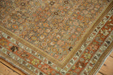 Vintage Bijar rug corner with distressed Herati motif, terracotta, silver, and faded yellow tones.