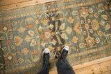 Distressed vintage Persian Lilihan runner with faded floral patterns in slate blue and tangerine.