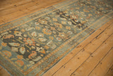 Vintage distressed Lilihan runner's softened pile texture, featuring serrated leaves and floral blossoms.