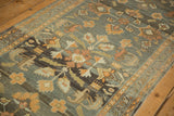 Vintage distressed Lilihan runner with charcoal field and terracotta floral blossoms.