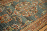 Distressed Kurdish Hamadan rug: slate blue abrashed ground with rust trefoil germinating plant finials.