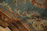 Worn pile of a distressed Kurdish Hamadan rug, featuring abrashed slate blue and madder root rust.