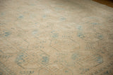 Vintage distressed Ersari carpet with cream and dusty teal geometric guls, showing faint foundation.