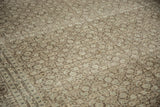 Distressed vintage Tabriz carpet showing Herati pattern in softened silver and charcoal.