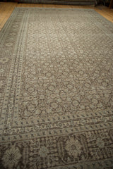 Herati design motif with distressed texture in time-softened silver, ivory, and dusty blue.