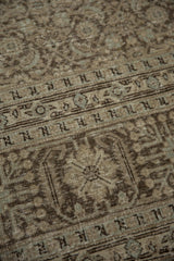 Distressed Herati design detail on vintage Tabriz rug, showing wear and soft oxidized colors.