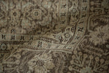 Distressed Tabriz carpet texture with softened Herati design in charcoal, silver, and blue.