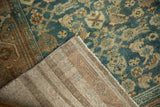 Hand-knotted foundation and distressed blue, tan, terracotta pile of a vintage Hamadan rug.