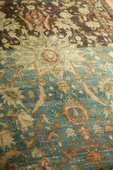 Textured low pile of a distressed Hamadan rug with heavily abrashed blue and brown fields.