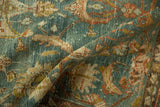 Worn, hand-knotted pile on the abrashed dusty blue ground of a vintage Hamadan rug.