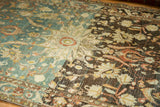 The dramatic color abrasion on a vintage Hamadan rug, shifting from dusty blue to chocolate brown.