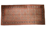 Antique Persian Joshegan carpet: ivory allover floral field with navy and red pawn motif borders.
