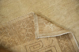 Corner view of a vintage Kars carpet showing the hand-knotted foundation and low, even pile.