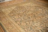 Time-softened Herati floral field and Samovar Turtle border motif on a distressed Mahal rug.