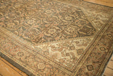 Distressed vintage Mahal rug corner, Samovar Turtle border, Herati field, visible foundation.