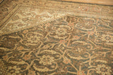 Vintage Mahal carpet detail, distressed Herati pattern, muted charcoal, sand, and terracotta.