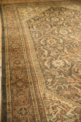 Distressed Mahal rug's Samovar Turtle border and Herati field in muted terracotta and charcoal.