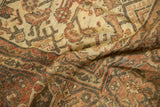Textured Herati floral and serrated leaf motif on distressed Mahal carpet.