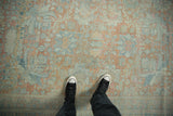 Distressed vintage Mahal carpet, faded floral palmettes on abrashed ground in blush and blue.