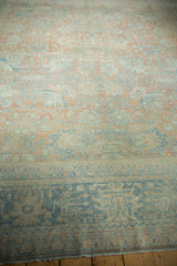 Mahal carpet lower border shows faded dusty blue, beige patterns and worn fringe.