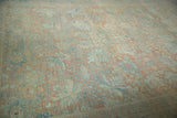 Distressed pile texture and muted floral pattern on vintage Mahal carpet.