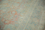 Distressed Persian Mahal carpet pile showing abrashed floral palmettes in blush and dusty blue.