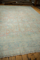 Distressed vintage Persian Mahal carpet pile, with faded floral palmettes and frayed end fringe.
