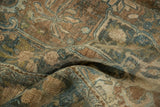 Distressed vintage Bijar carpet with abrashed pile and faded palmette vinery.