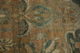 Distressed vintage Bijar rug features abrashed brown ground with faded blue floral vinery.