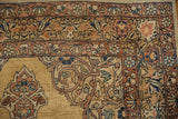 Intricate floral borders and scrolling arabesques on the corner of a vintage Persian Kerman runner.