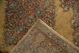 Folded corner of a vintage Kerman runner revealing the detailed hand-knotted weave and pile texture.