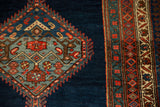 Detail of a serrated hexagonal medallion and pawn design border of an antique Bijar runner.