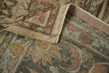 Distressed Lilihan carpet's pile showing germinating plants in faded terracotta and dusty gold.