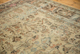 Distressed Lilihan carpet close-up, beige field with serrated leaves, palmettes, and time-softened hues.