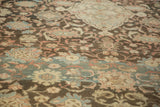 Heavy abrash creating color bands across the worn, even pile of a vintage Mahal carpet.
