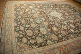 Angled view of a vintage Mahal carpet highlighting its heavy color abrashes.