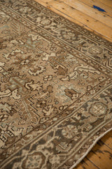 Angled view of the Turtle Samovar border and geometric motifs on a distressed Mehrivan carpet.