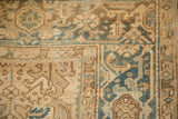 Classic Turtle Samovar border motif and even wear on a distressed Persian Heriz carpet.
